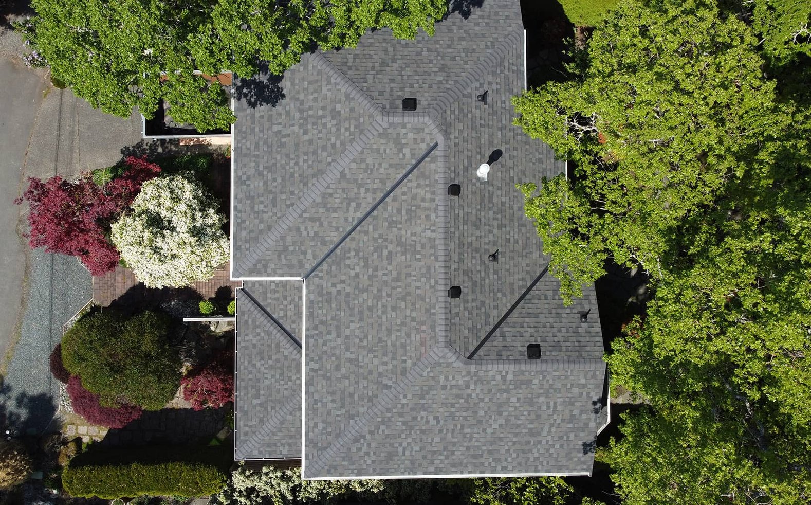 McGuire Roofing crew completing a residential roof replacement